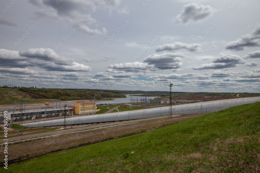Sergiyev Posad, Russsia - May 18, 2022: Zagorskaya hydro power plant pipes on grey sky background