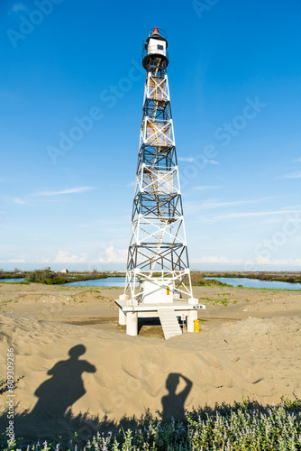 Building view of the Guosheng Lighthouse in Qigu, Tainan, Taiwan. The westernmost point of Taiwan and Taijiang National Park Attractions. photo