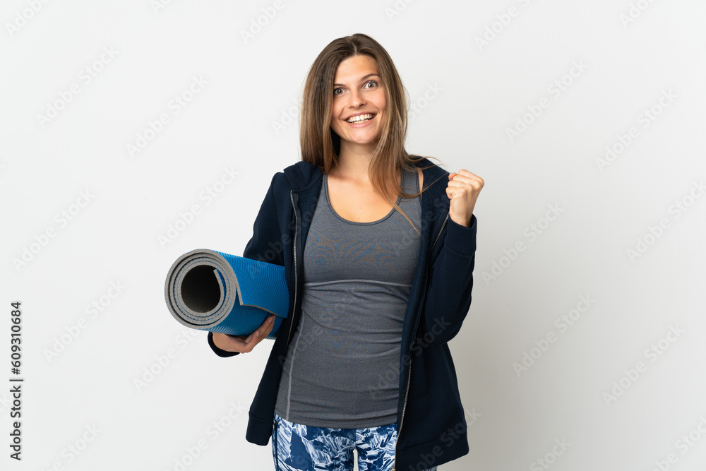 Slovak girl going to yoga classes isolated on white background celebrating a victory in winner position Slovak girl going to yoga classes isolated on white background celebrating a victory in winner position