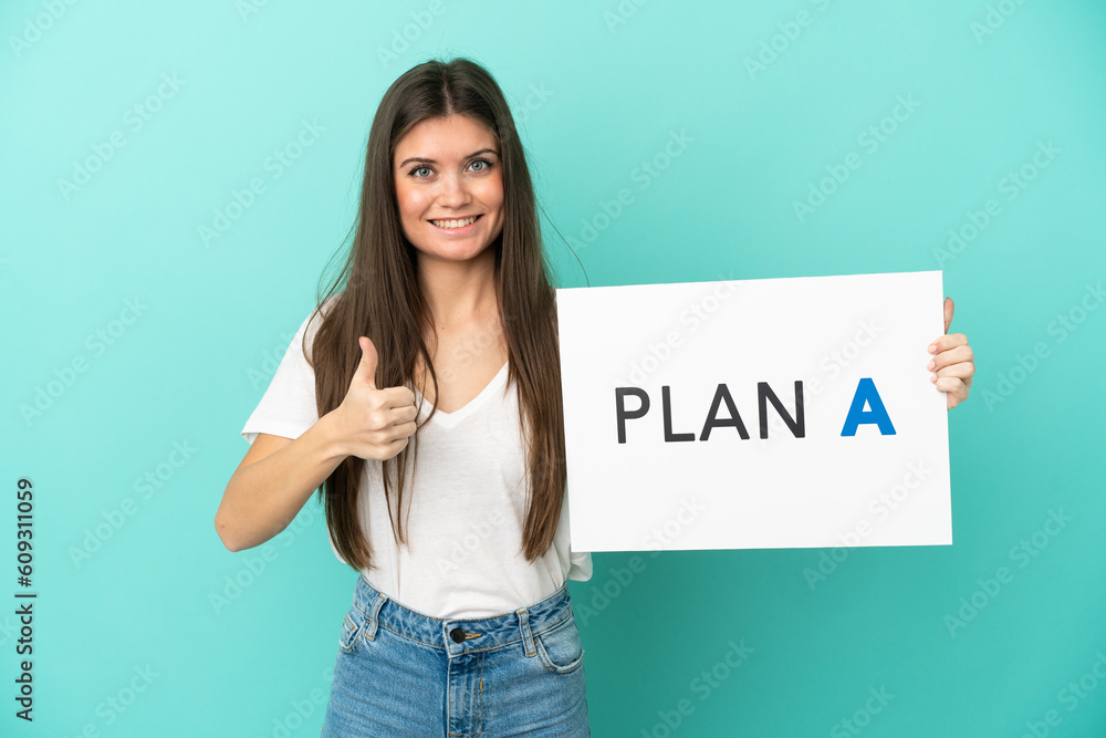 Young caucasian woman isolated on blue background holding a placard with the message PLAN A with thumb up Young caucasian woman isolated on blue background holding a placard with the message PLAN A with thumb up