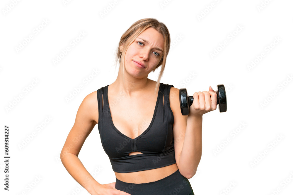 Blonde sport woman making weightlifting over isolated chroma key background with sad expression Blonde sport woman making weightlifting over isolated chroma key background with sad expression
