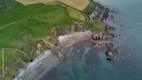 large beach with rock formations from a cliff. Tra na mB?Beach. Cooper Coast, Waterford, Ireland
