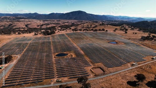 Aerial landscape panning over Solar Panel Farm near Tuggeranong, ACT Drone 4K