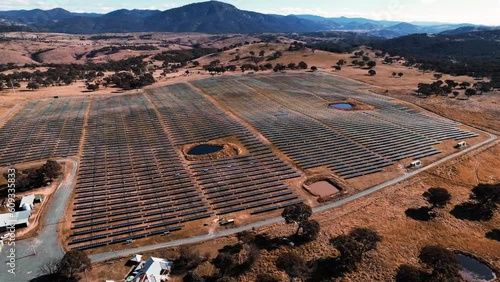Aerial landscape panning over Solar Panel Farm near Tuggeranong, ACT Drone 4K