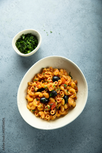 Homemade pasta puttanesca with fresh parsley