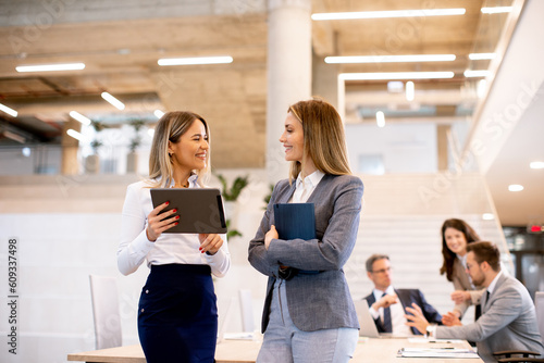 Two young business women lo...