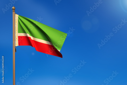 Chechen Republic. Flag blown by the wind with blue sky in the background.