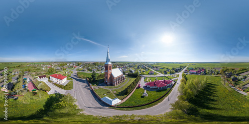 full hdri 360 panorama aerial view on red brick neo gothic catholic church in countryside or village in equirectangular projection with zenith and nadir. VR AR content