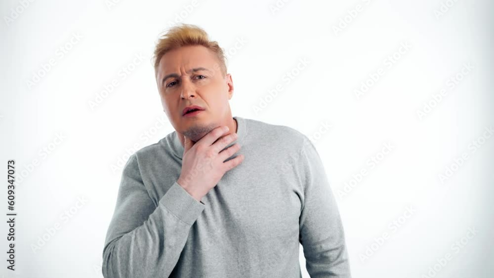 Man, sore throat and pain with medical, health or wellness problem. Sick unhappy ill guy male with hand on neck for allergies or virus, healthcare in studio isolated on white background Man, sore throat and pain with medical, health or wellness problem. Sick unhappy ill guy male with hand on neck for allergies or virus, healthcare in studio isolated on white background