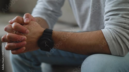 Hands close up of unrecognizable man feeling worried. Troubled man moving hands expressing anxiety and nervous strain