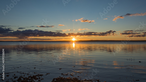 Midnight sun over the Porttipahta reservoir lake in Lapland  Finland