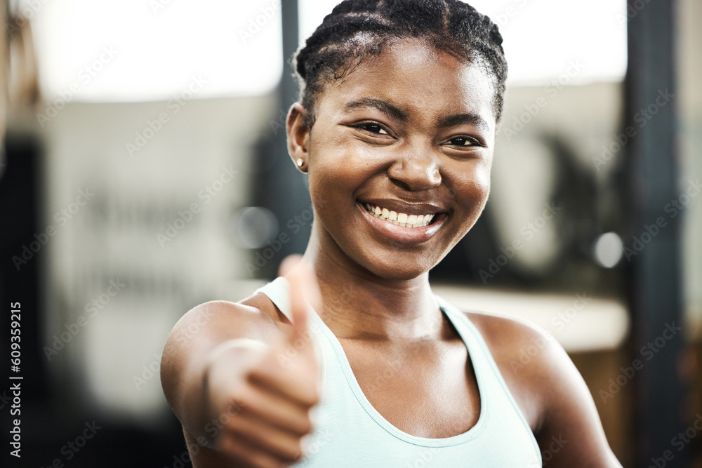Thank you, portrait of black woman with thumbs up and at gym happy for workout. Success or achievement, support or smile and African female athlete with emoji hand for motivation or fitness.