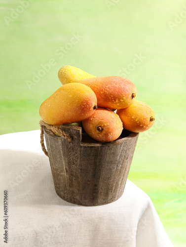 fresh fruit mango on a basket 
