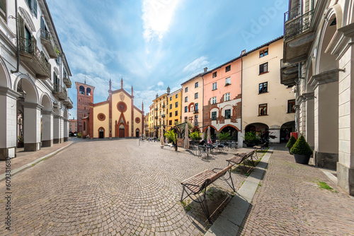 Pinerolo, Turin, Piedmont, Italy - landscape of San Donato square with San Donato Cathedral (10th - 15th cent.) and and ancient mediaeval palaces with arcades photo