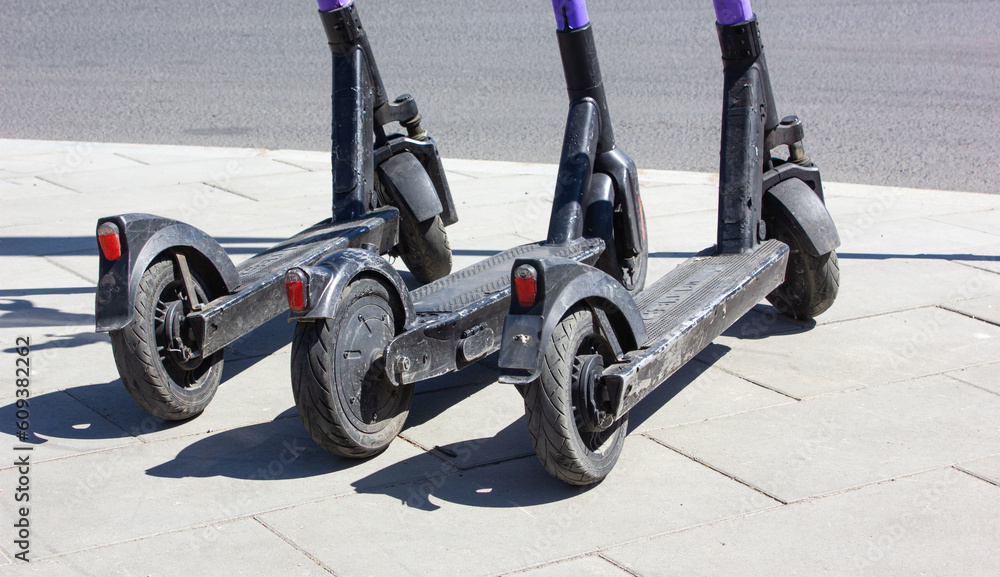 Electric scooter parking in the city. Public eco-transport. Electric scooters in the city. Electric scooter parking in the city. Public eco-transport. Electric scooters in the city.