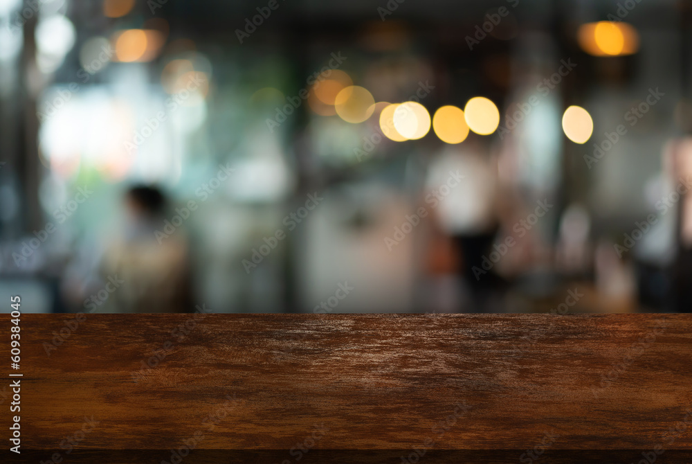 Wooden top table on blur restaurant background.