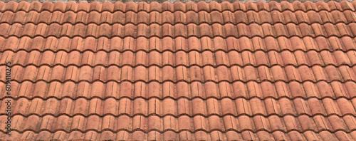 panorama of grunge antique roof clay tiles of thai temple or ancient house