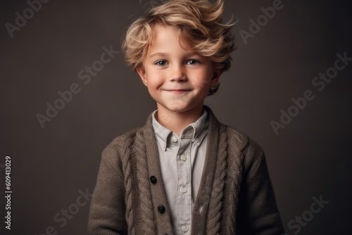 Medium shot portrait photography of a satisfied child male that is wearing a chic cardigan against a minimalist or empty room background . Generative AI