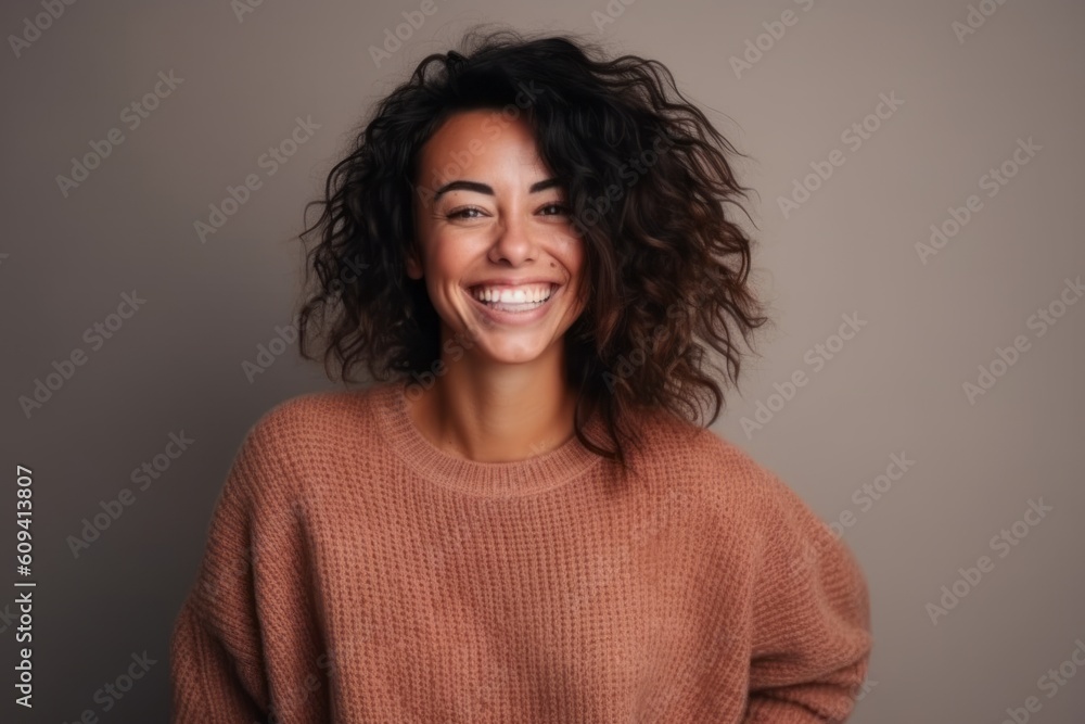 Portrait of a beautiful young woman with curly hair smiling at camera Portrait of a beautiful young woman with curly hair smiling at camera