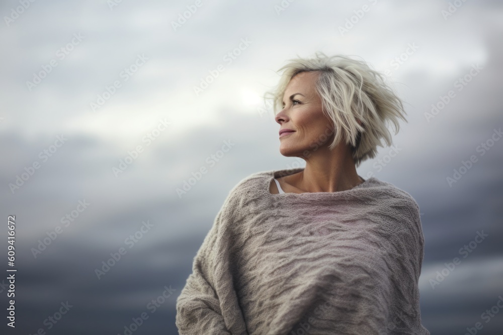 Portrait of a beautiful blonde woman on the background of the sky Portrait of a beautiful blonde woman on the background of the sky