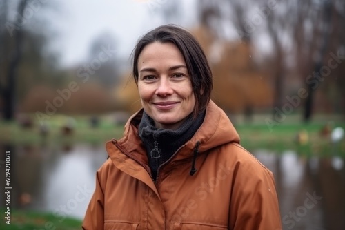 Portrait of a beautiful young woman in a brown coat in autumn park © Hanne Bauer