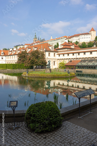 Gardens with pond of the Waldstein / Vakdstejn palace in Mala Strana, Prague, Czech Republic. On the hill the St. Vitus's Cathedral.l the St. Vitus's Cathedral. photo