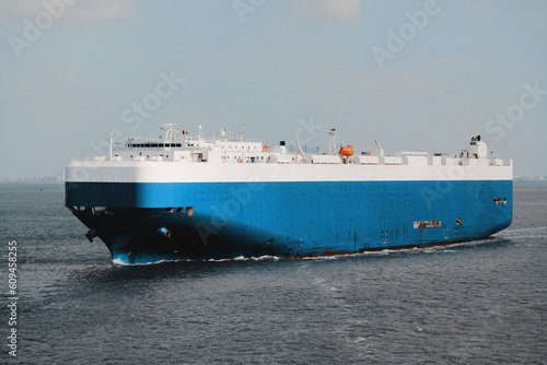 Pure car carrier underway at sea. Fully loaded ro-ro vessel with the cargo of vehicles of different weight and size. photo