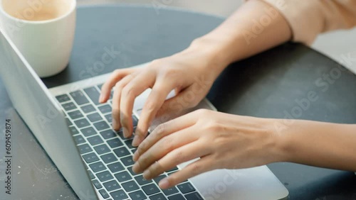 Close up on female hands business people typing on laptop computer keyboard, Freelance work anywhere, remote work, didital nomad concept.