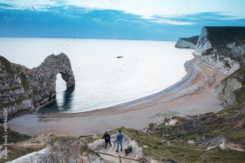 Photographers waiting for the sunset at Durdle Door along the Jurassic coast.