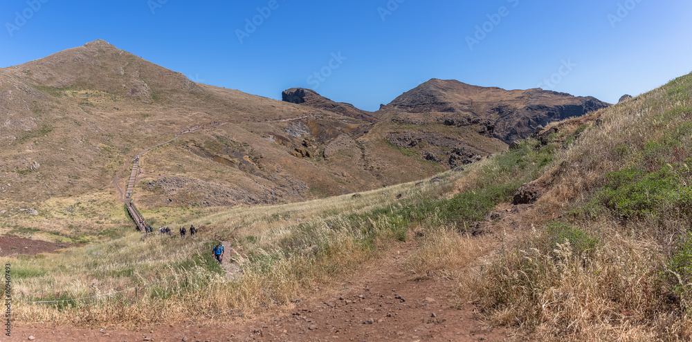 Panoramic view of a group of tourists hiking in St. Lourenço Cape or Cabo de São Lourenço, on Madeira Island, Portugal