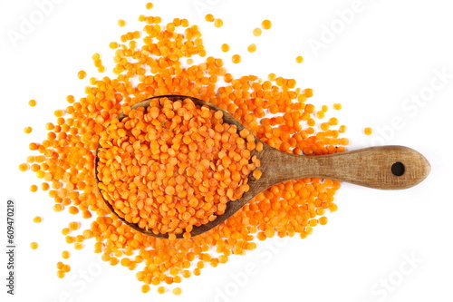 Pile red lentils isolated on white, top view  photo