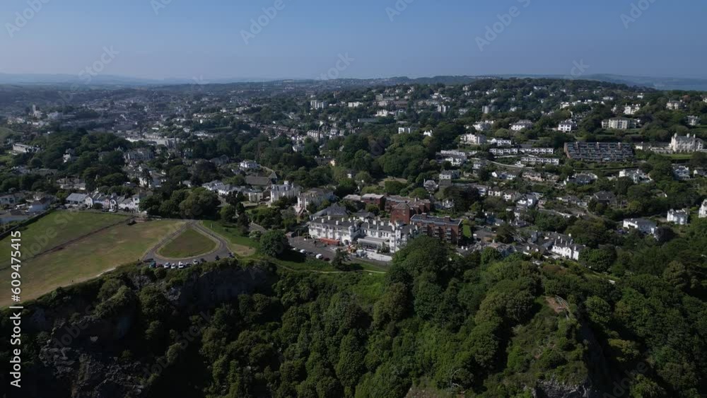 Torquay, Torbay, South Devon, England: DRONE AERIAL VIEWS: The drone reverses from Daddyhole Plain giving views of seafront hotels and properties, rugged cliffs and the coastline and Meadfoot Beach. Torquay, Torbay, South Devon, England: DRONE AERIAL VIEWS: The drone reverses from Daddyhole Plain giving views of seafront hotels and properties, rugged cliffs and the coastline and Meadfoot Beach.