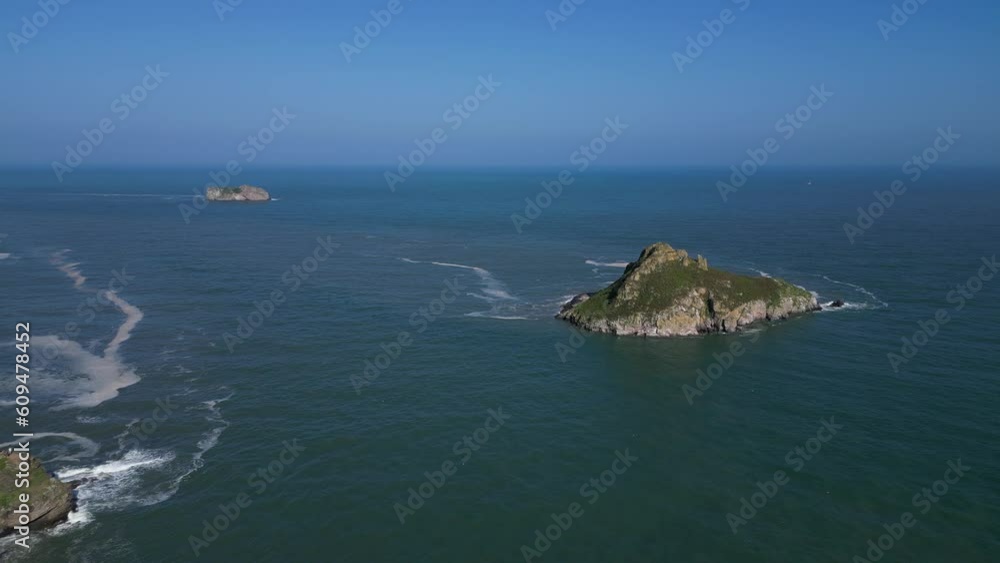 Torquay, Torbay, South Devon, England: DRONE AERIAL VIEWS: The drone flies towards Thatcher Rock (nearest camera) and Orestone Rock showing the rugged coastline and sea. Torquay, Torbay, South Devon, England: DRONE AERIAL VIEWS: The drone flies towards Thatcher Rock (nearest camera) and Orestone Rock showing the rugged coastline and sea.