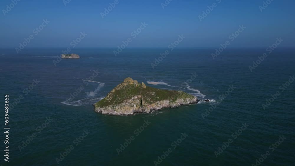 Torquay, Torbay, South Devon, England: DRONE AERIAL VIEWS: The drone flies towards Thatcher Rock (with Orestone Rock in the background) for a general view of the island. Torquay, Torbay, South Devon, England: DRONE AERIAL VIEWS: The drone flies towards Thatcher Rock (with Orestone Rock in the background) for a general view of the island.