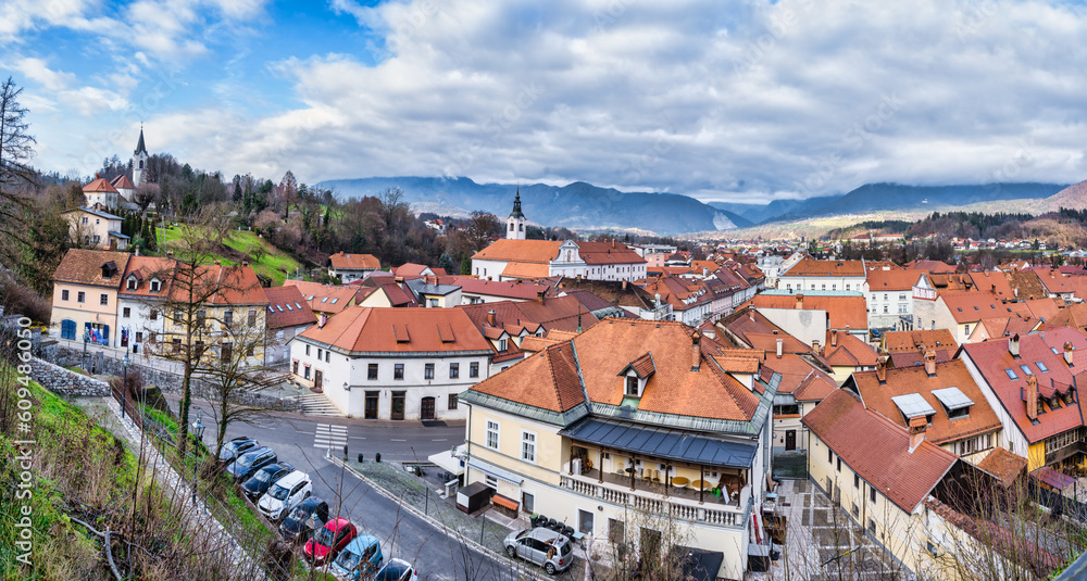Panorama shot of Kamnik town old buildings and the Church of St Joseph on the hill, Mamnik, Slovenia