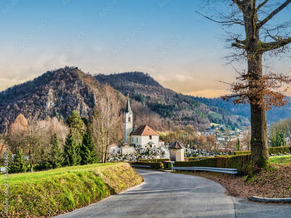 Winding road, Kamnik cemetery and St Joseph church during senset, Kamnik, Slovenia