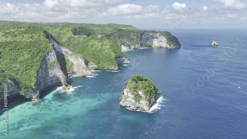 Aerial Drone Stock Footage of Nusa Penida, Bali, Indonesia tall cliffs along coastline of blue tropical ocean (HDR ProRes HLG Rec.2020 video) 