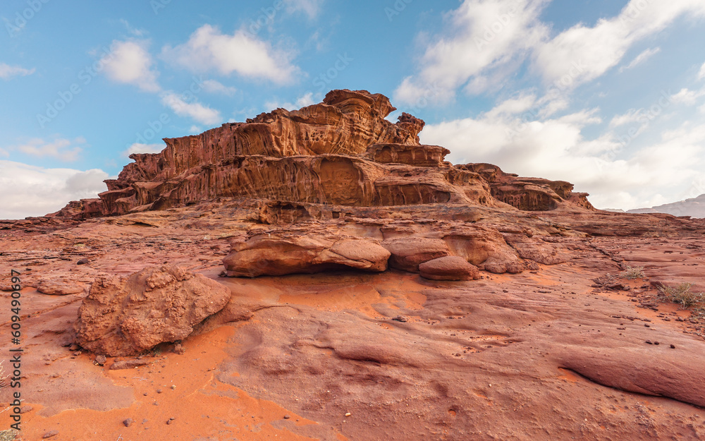 Red orange sandstone rocks formations in Wadi Rum (also known as Valley of the Moon) desert, Jordan