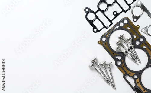 Spare parts for car engine repair on a white background. Top view, copy space
