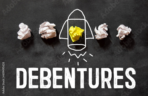 destroyed tower made of planks, on the red plate there is an inscription - Debenture