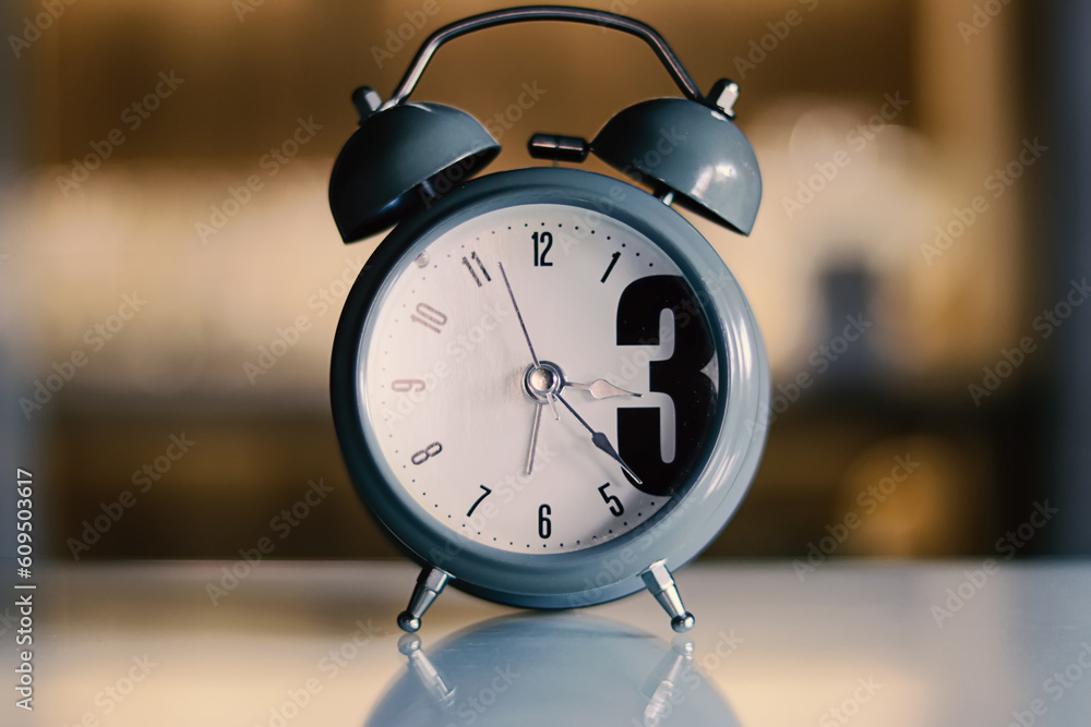 Close View of Grey Retro Clock on Wooden Table Close View of Grey Retro Clock on Wooden Table