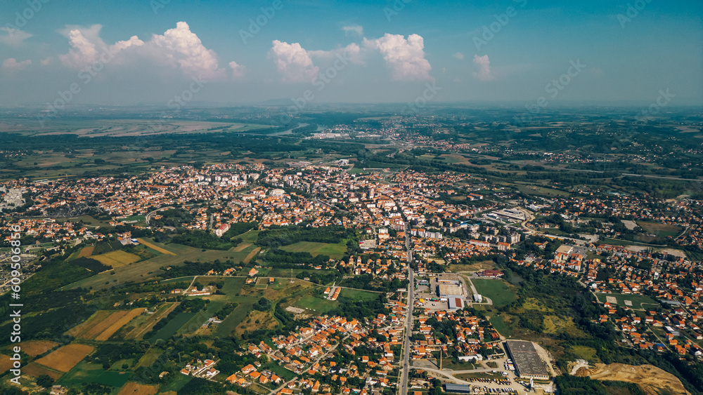 Areal drone footage of a suburb small town with private houses