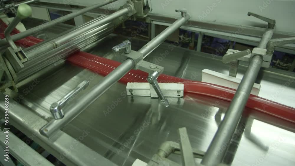 static close up shot of a caramel mass molding line in a candy factory static close up shot of a caramel mass molding line in a candy factory