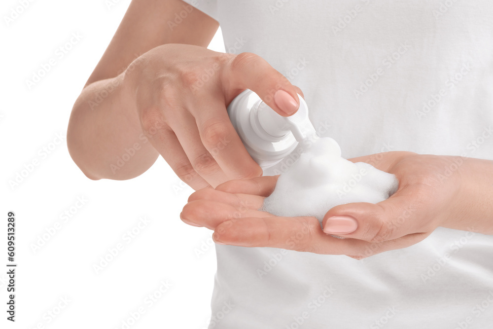 Woman applying cleansing foam onto hand on white background, closeup Woman applying cleansing foam onto hand on white background, closeup