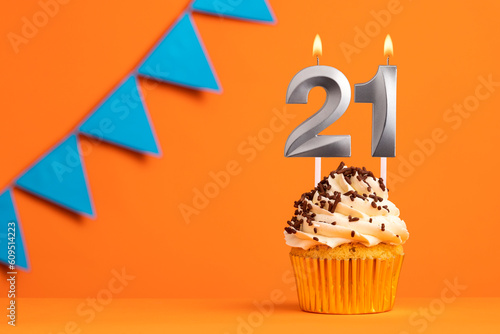 Birthday cake with candle number 21 - Orange background