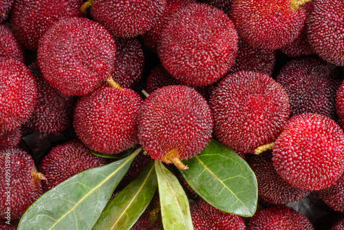 Photos Arbutus berries Fruit or Red Yangmei in basket, Red Bayberry, Yumberry, yamamomo, Waxberry in basket