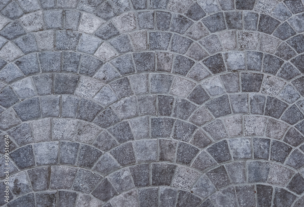 Gray floor tiles in a circular pattern