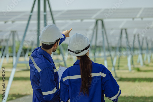 Canvas Print Renewable energy analyst conduct filed observations on solar farming to monitor and assess efficiency