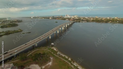 Wallpaper Mural Aerial Panning Shot Of Bridges On Sea In City Against Cloudy Sky, Drone Flying Over Buildings - Daytona Beach, Florida Torontodigital.ca