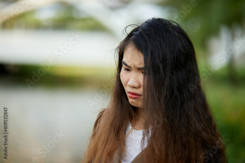 Vietnamese woman in the park during lunchtime in Vietnam. 